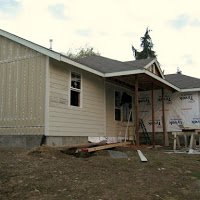 Windows, framing, and vapor barrier installed. Now the siding is being installed.