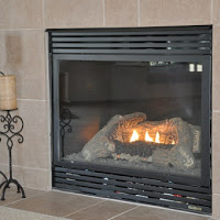 Gas fireplace with tile.